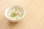 Congee Bowl On Wood Texture Tile Floor Stock Photo