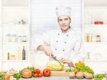 Female Chef Preparing Meal Stock Photo