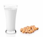 Fresh Milk In The Glass With Soy Beans On White Background Stock Photo