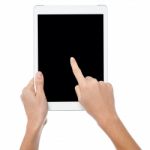 Finger Being Pointed On Tablet Screen Stock Photo