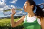 Woman Drinking Water After Sport Activities Stock Photo