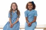 Cheerful Kids Relaxing On School Bench Stock Photo