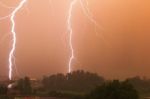 Double Vertical Lightning At Sunset Stock Photo