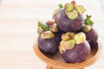 Group Of Mangoesteen On Wooden Tray Stock Photo