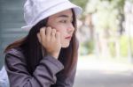 Thai Adult Girl White Cap Gray T-shirt Beautiful Girl Relax And Smile Stock Photo