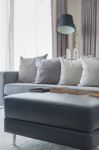 Row Of Pillows On Modern Grey Sofa Stock Photo