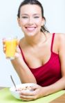 Young Woman Having Breakfast At Home Stock Photo