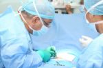 Doctor Making A Suture In Operation Room Stock Photo