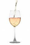 White Wine Flowing Into A Glass Isolated On White Stock Photo