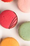 Colorful Macaroons On White Background. Macaron Or Macaroon Is S Stock Photo