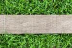 Grain Wood On Green Grass Stock Photo