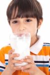 Happy Kid Drinking Glass Of Milk Stock Photo