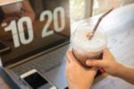 Woman Using Laptop In The Coffee Shop Stock Photo