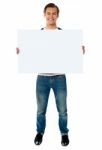 Young Male Holding Blank Board Stock Photo