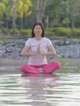 Women Practices Yoga Stock Photo