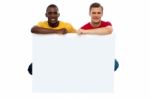 Young Guys Holding Blank Board Stock Photo