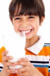 Young Kid With Glass Of Milk Stock Photo