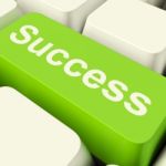 Success Computer Key In Green Stock Photo