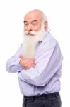 Senior Man Standing Sideways To Camera Stock Photo