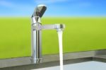 Water Flow Faucet Granite Counter On Green Environment Stock Photo