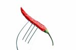 Red Chili Pepper On A Fork Stock Photo