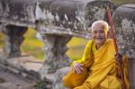 An Unidentified Old Buddhist Female Monk Dressed In Orange Toga Stock Photo