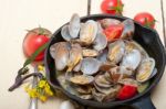 Fresh Clams On An Iron Skillet Stock Photo