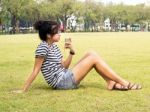 A Young Girl With Headphones Outdoors. Listening Music Stock Photo