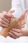 Woman Enjoying Hand Massage At Beauty Spa Stock Photo