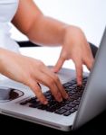 Hands Typing On Laptop Stock Photo