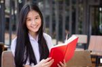 Asia Thai High School Student Uniform Beautiful Girl Read A Book Stock Photo