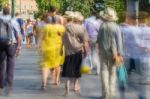 Blurry People Walking In The Street Stock Photo