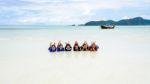 Happy Family Lying Together On The Beach, Thailand Stock Photo