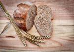 Fresh Bread On A Wooden Table Stock Photo