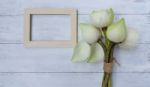 Fresh Lotus Flower Bouquet With Wood Frame On White Table Stock Photo