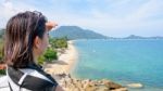 Woman Tourist Are Looking At The Sea Stock Photo