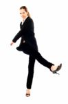 Businesswoman Kicking Stock Photo