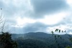 The Beauty Of The Sky When Light Hits The Clouds And Mountain Stock Photo