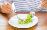 Women Eating Fresh Salad Stock Photo