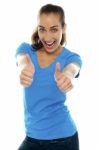 Overjoyed Woman Showing Double Thumbs Up Stock Photo