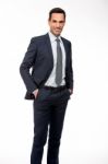 Businessman With Hand In Pockets Stock Photo