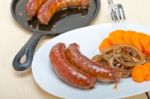 Beef Sausages Cooked On Iron Skillet Stock Photo