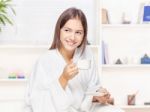 Woman In Bathrobe Relaxing At Home Stock Photo