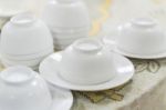 Empty White Plate And Small Chalice On Table Stock Photo