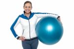 Pretty Woman Holding Big Blue Pilate Ball Stock Photo