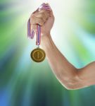 Hand And Gold Medal Stock Photo