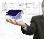 Businessman Present House Model Stock Photo