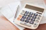 Calculator And Pen On Bank Account Passbook Stock Photo