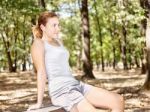 Girl In Park Enjoying Music Stock Photo