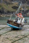 Fishing Boat In Port Isaac Cornwall Stock Photo